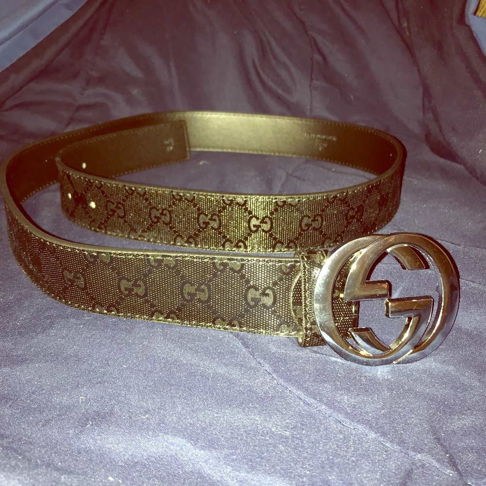 Black Gucci belt with silver Gucci  buckle